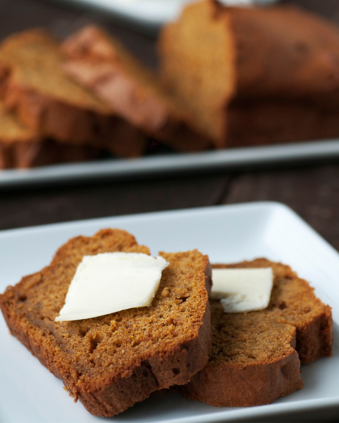 Slices of pumpkin chai bread with butter