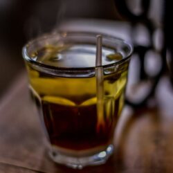 Steaming glass of brewed tea
