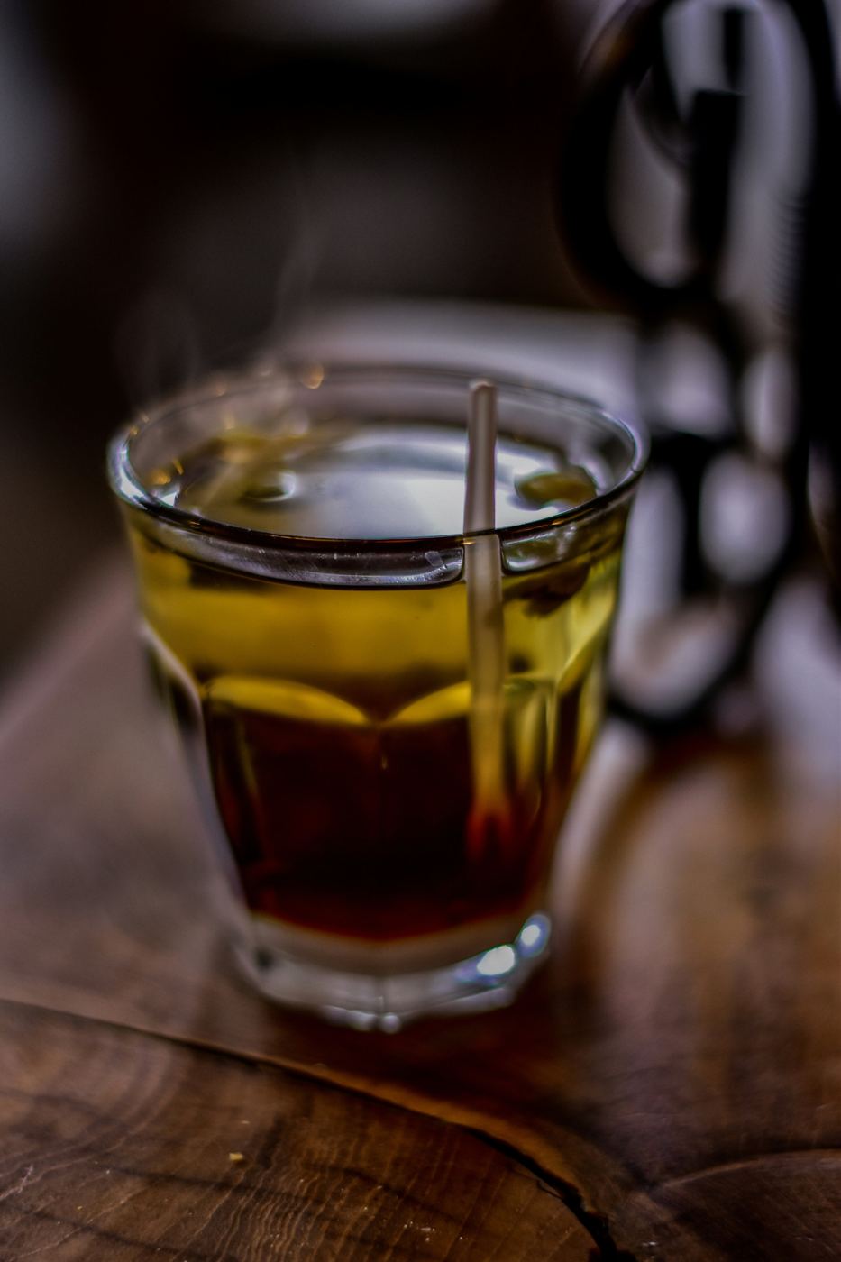 Steaming glass of brewed tea