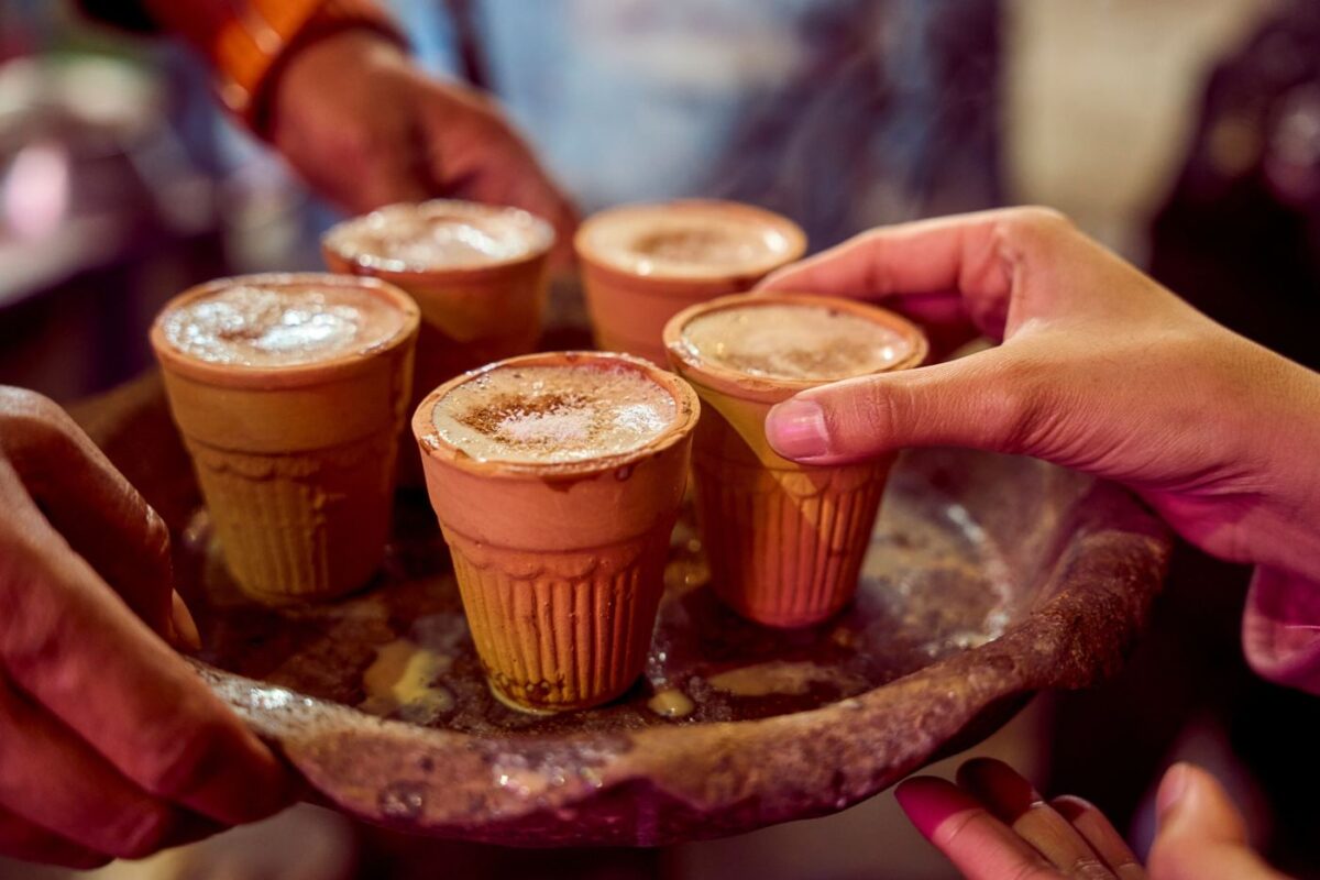 Traditional Indian masala chai served in small clay kulhad cups on a tray