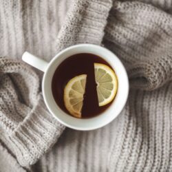 Cup of Earl Grey black tea garnished with fresh lemon slices