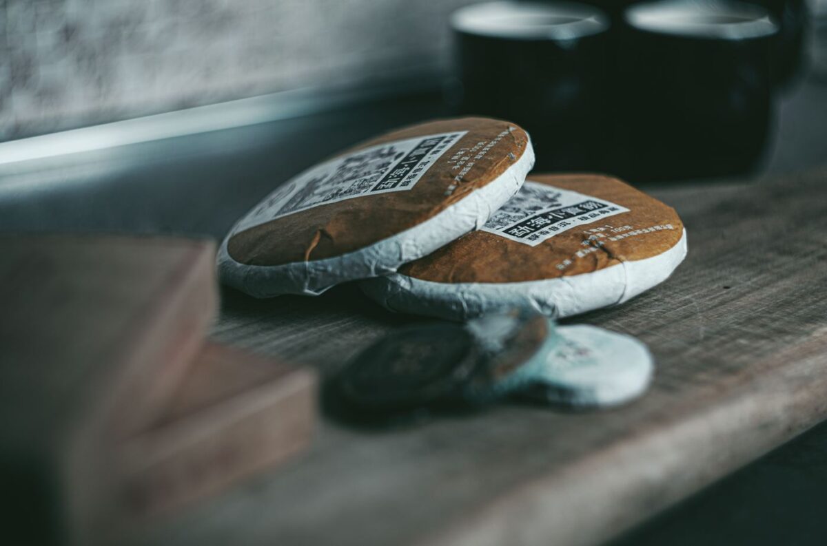 Compressed pu-erh tea cakes wrapped in paper