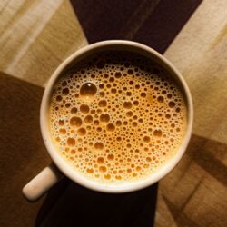 Foamy milky London Fog tea latte in a ceramic mug