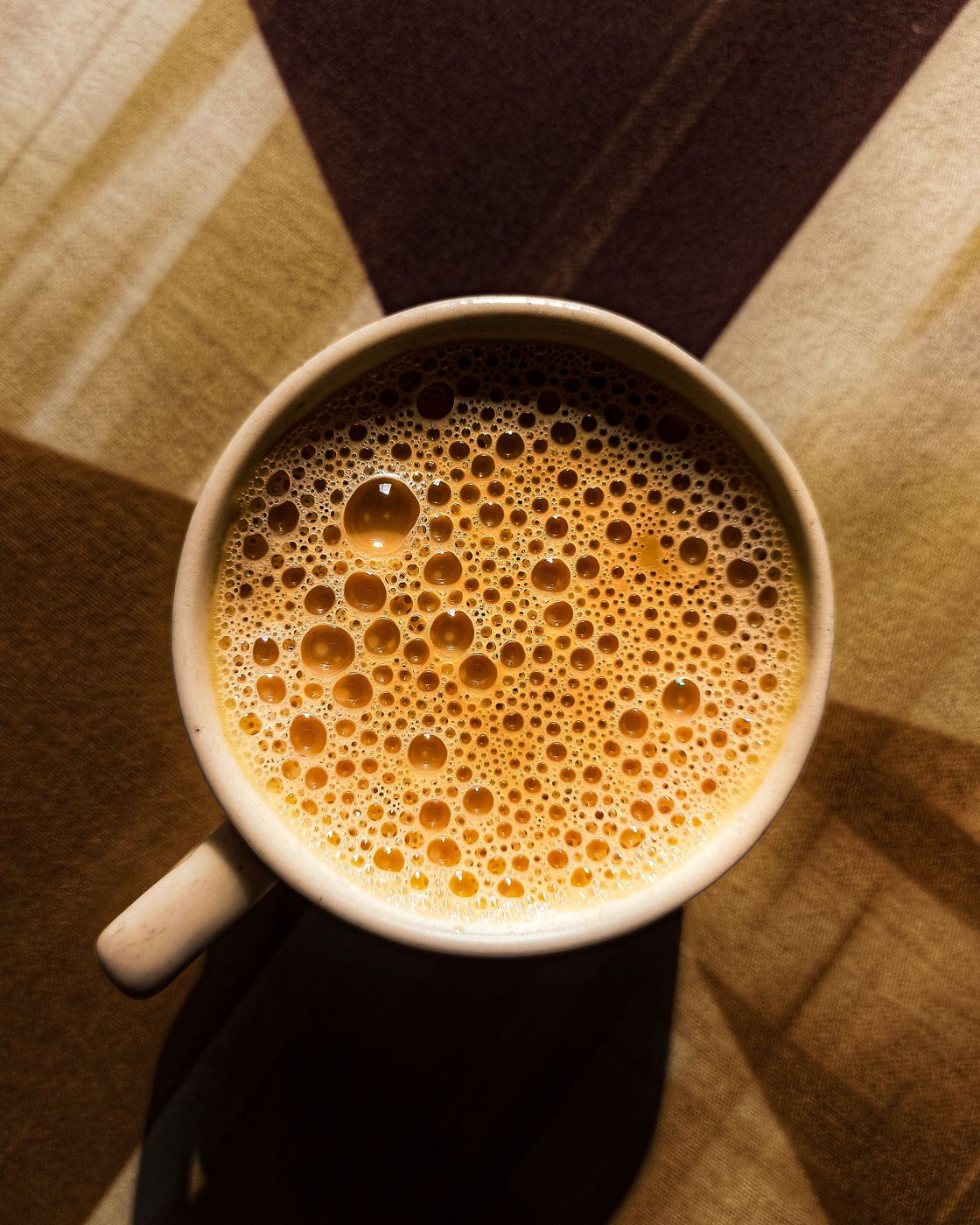 Foamy milky London Fog tea latte in a ceramic mug
