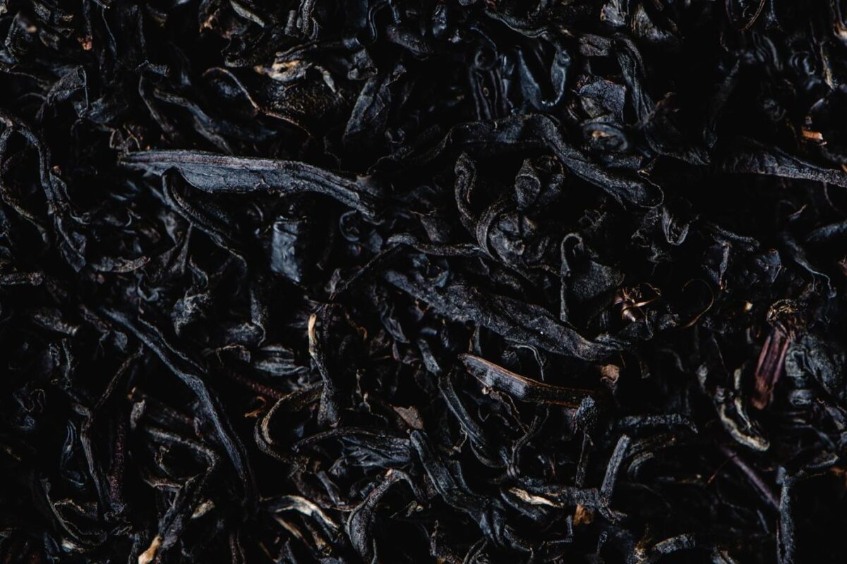 Whole, unbroken black tea leaves typical of the OP (Orange Pekoe) grade