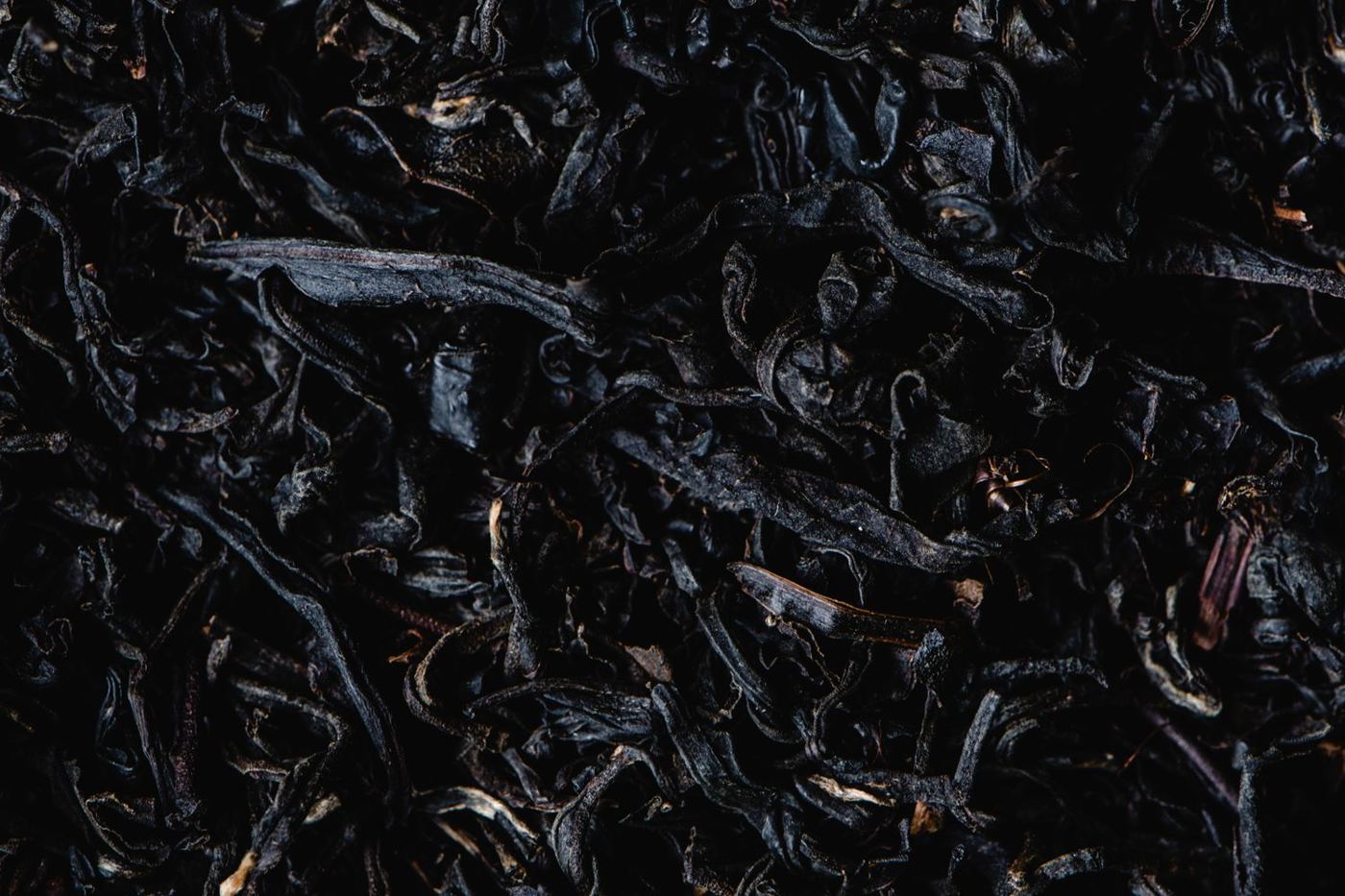 Whole, unbroken black tea leaves typical of the OP (Orange Pekoe) grade