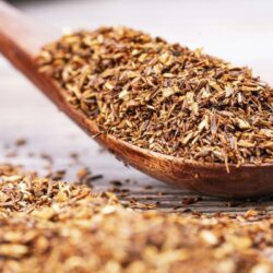 Close-up of reddish-brown cut rooibos tea pieces