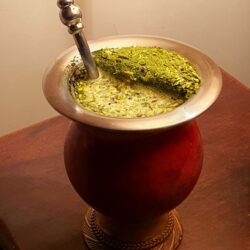 Traditional mate gourd filled with yerba mate and metal bombilla straw