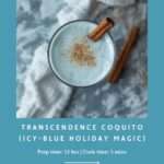 A top-down view of a pale icy-blue coquito in a glass, topped with cinnamon and garnished with two cinnamon sticks. The drink sits on a marble surface with a white textured cloth. Surrounding the image is a teal graphic border with text reading “Transcendence Coquito (Icy-Blue Holiday Magic), Prep time: 12 hrs | Cook time: 5 mins, @moody.teas."
